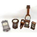 A collection of ten mahogany, oak and painted mantel clock cases, and a modern wall timepiece, a