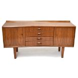 GORDON RUSSELL; a mid-century Bombay rosewood sideboard, with four central drawers flanked by