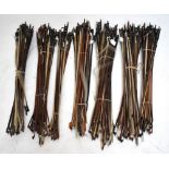 A large collection of predominantly violin bows contained in eight bundles (approx 175).