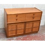 NATHAN FURNITURE; a teak side unit, with four short drawers and two panelled cupboard door, on