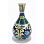 LEONARD KING FOR BURMANTOFTS; an art pottery vase of baluster form with flared neck, with floral