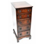 An Edwardian mahogany narrow chest of five drawers raised on bracket feet, height 97cm, width 40.