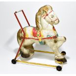A 1950s painted metal push-along horse, height 52cm.