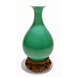 A Chinese porcelain apple green glazed Yuhuchunping shaped vase, bears Qianlong seal mark and