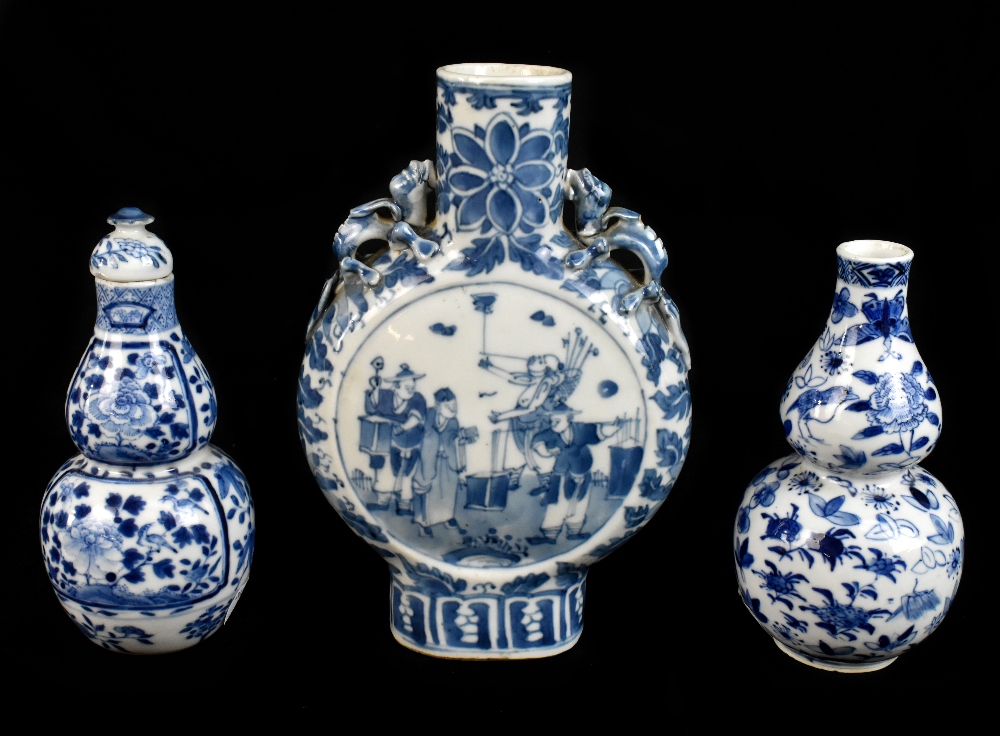 A late 19th century Chinese blue and white porcelain twin handled moon flask with moulded handles