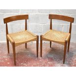MORGEN-KOHL; a set of six Danish rush seated teak framed dining chairs raised on turned column