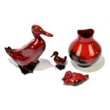 ROYAL DOULTON; three flambé figures comprising a duck and ducklings, height of duck 15cm and a