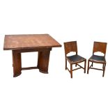 A late Art Deco oak extending dining table and four chairs, the rectangular table with two pull