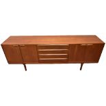 A.H. MACINTOSH; a mid-century teak sideboard, with four central drawers flanked on each side by