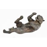 A bronze figure of a tiger lying on its back, unsigned, length 39cm.