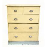 An Edwardian painted pine chest, with two short and three long drawers with cusp handles, on