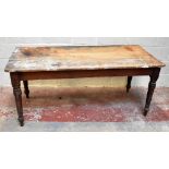 An Edwardian pine rustic farmhouse kitchen table, the rectangular top with rounded corners, on