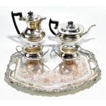 VINERS OF SHEFFIELD; a silver plated four piece tea service raised on claw feet, and associated