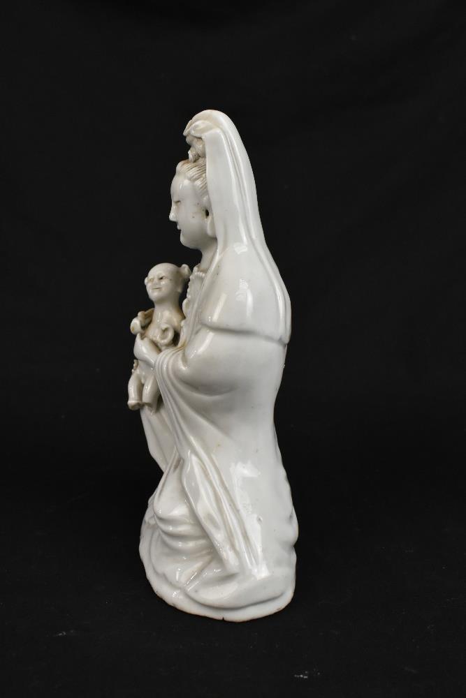 Two 19th century Chinese Blanc de Chine figures of Guan Ying including an example holding a child, - Image 5 of 11