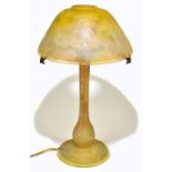 DAUM NANCY; an impressive Art Nouveau cameo glass table lamp with mushroom shade, with wheel cut