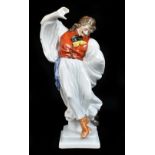 HEREND; a ceramic figure representing a dancing cavalier, blue painted marks to the underside,