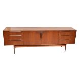 MCINTOSH; a mid-century teak sideboard, with a pair of central doors flanked on each side by three
