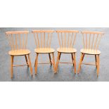 POUL VOLTHER FOR FDB DENMARK; a set of four 1960s beech spindle back dining chairs, raised on turned