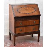 An early 20th century mahogany bureau, the fall front enclosing single drawer and fitted interior