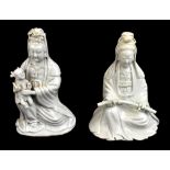 Two 19th century Chinese Blanc de Chine figures of Guan Ying including an example holding a child,