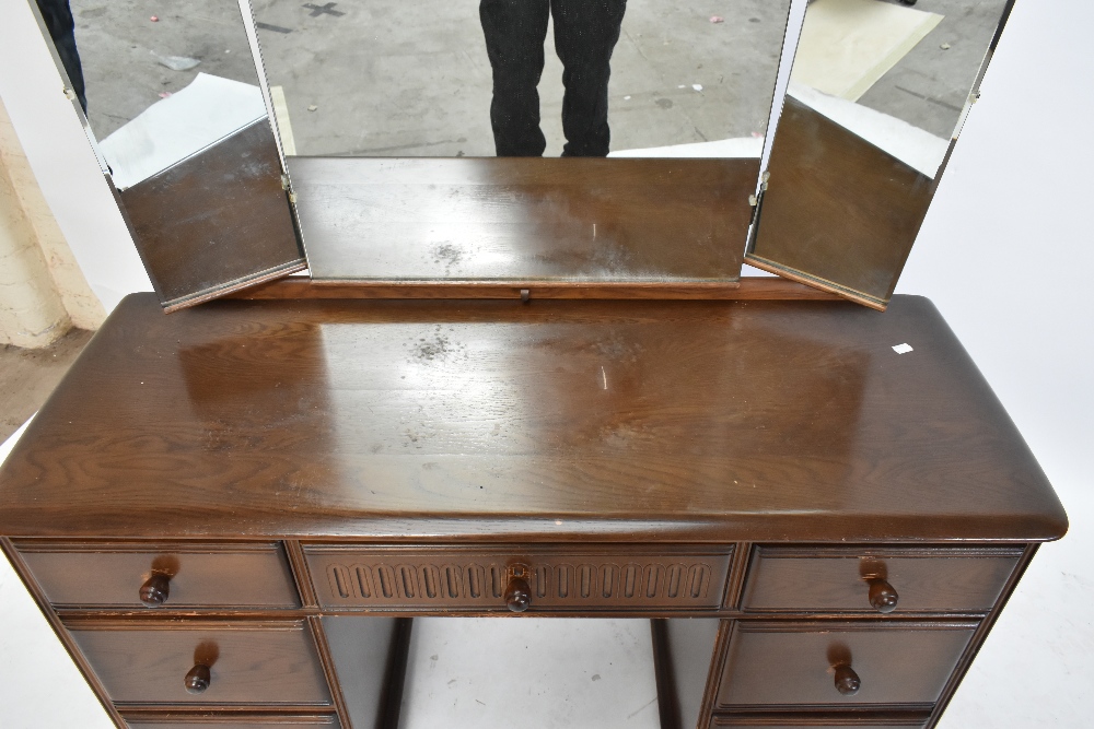 A reproduction elm Priory style mirror back dressing table, with an arrangement of seven drawers, - Image 5 of 9