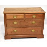 An early 20th century walnut chest of two short and two long drawers with ash top, raised on