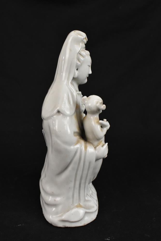 Two 19th century Chinese Blanc de Chine figures of Guan Ying including an example holding a child, - Image 3 of 11