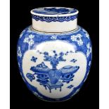 A late 19th century Chinese blue and white ginger jar and cover, the cover painted with a shishi