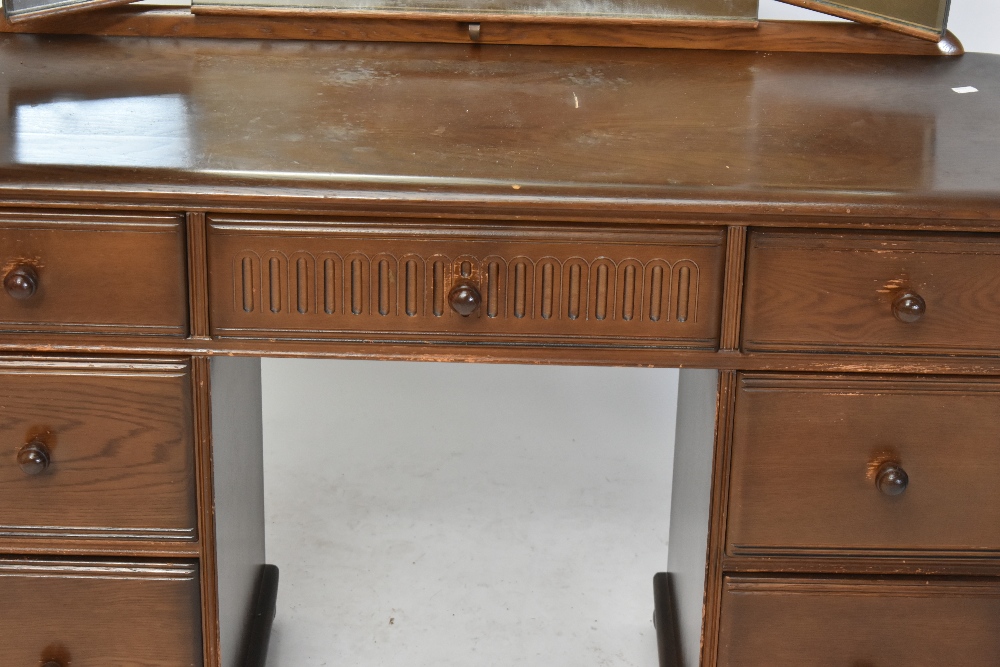 A reproduction elm Priory style mirror back dressing table, with an arrangement of seven drawers, - Image 3 of 9