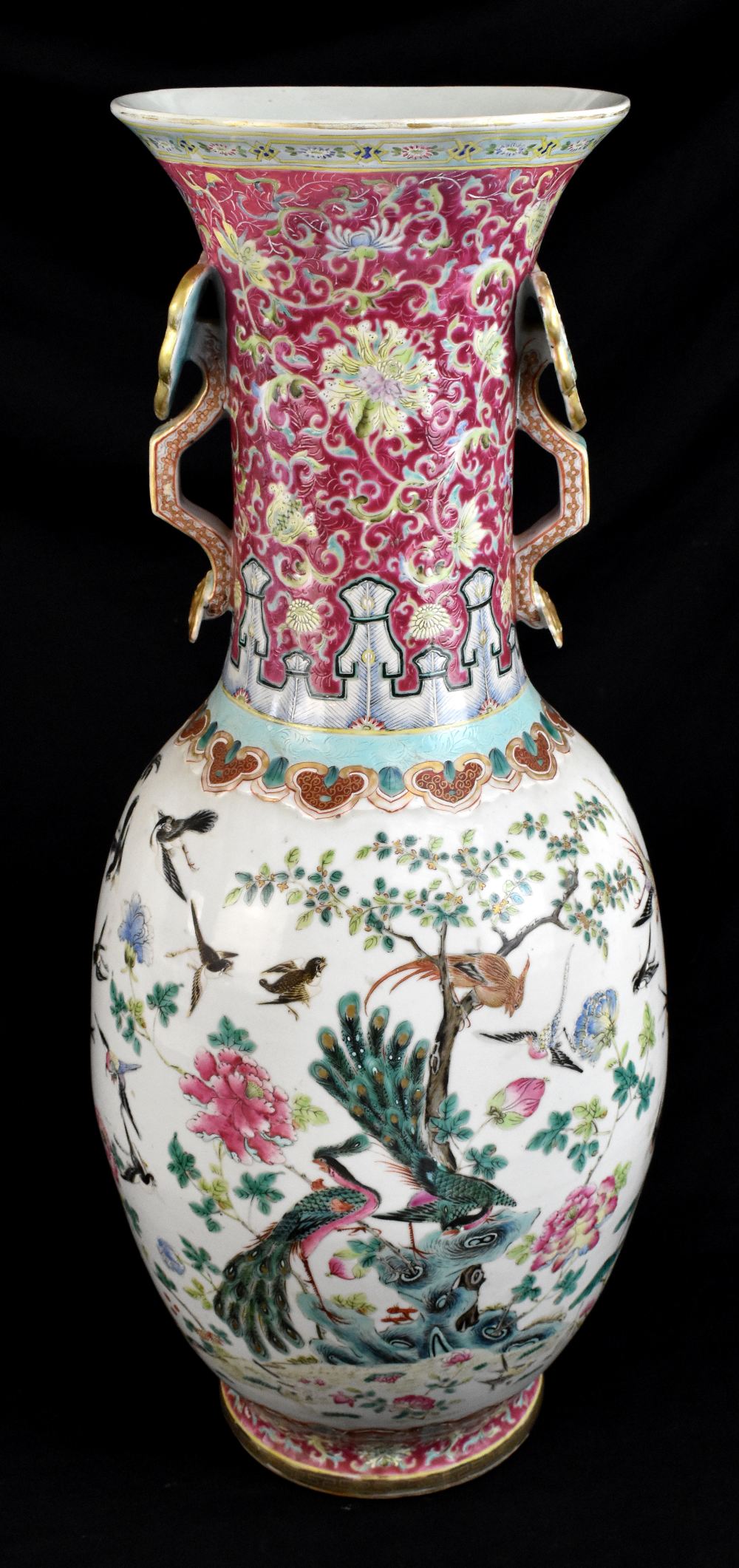 A large 19th century Chinese porcelain twin handled Famille Rose vase with flared neck with