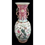 A large 19th century Chinese porcelain twin handled Famille Rose vase with flared neck with