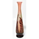 AFTER EMILE GALLE; a cameo glass vase of tapered cylindrical form with elongated neck with floral