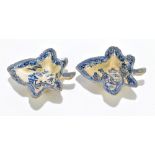 CAUGHLEY; a pair of late 18th century blue and white leaf shaped pickle dishes decorated in a