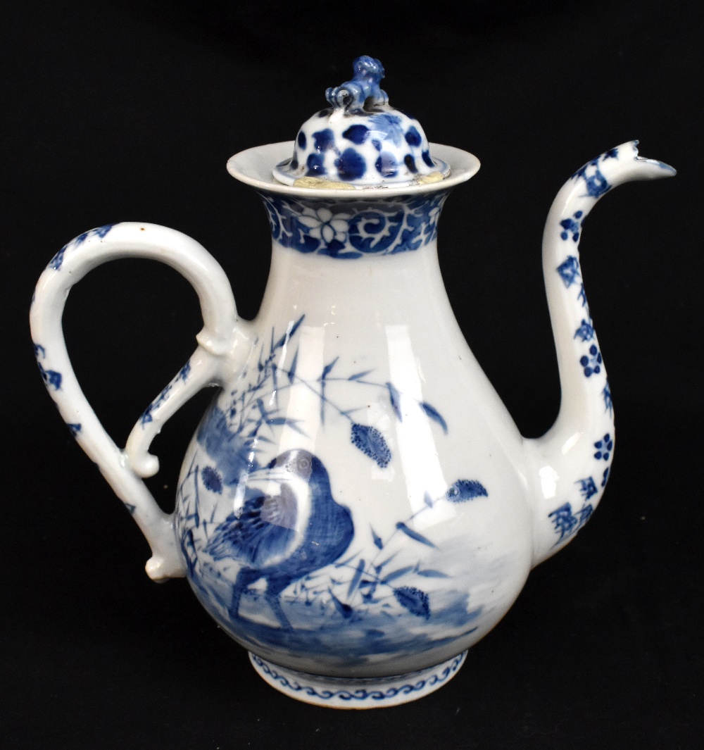 An 18th century Chinese blue and white ewer decorated with two different birds and floral motifs,