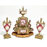 A 19th century gilt metal and Sevres style porcelain mounted clock garniture, on associated