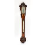 W BANKS OF BOSTON; a 19th century oak stick barometer, with carved detail to the top and edges and a