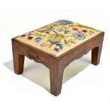 DAVID OAKLEAF MANN LANGSTAFF OF EASINGWOLD, YORKSHIRE; an oak framed stool with tapestry inset