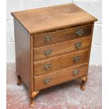 An early 20th century mahogany chest of four drawers, raised on cabriole supports terminating on pad