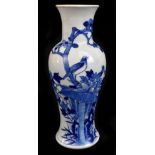 A late 19th century Chinese Kangxi style blue and white vase, decorated with two birds and flowers