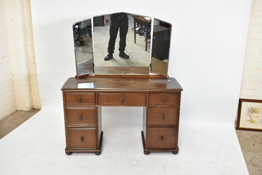 A reproduction elm Priory style mirror back dressing table, with an arrangement of seven drawers, - Image 7 of 9