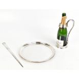 A silver plated Champagne bottle holder with cast beaded decoration to the handle and engine