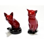 ROYAL DOULTON; two flambé animal form figures comprising a seated cat, height 13cm and a fox (2).