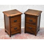 A pair of modern oak effect bedside chests of two drawers, height 55cm, width 35cm, depth 31.5cm.