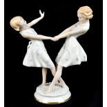 C. WERNER FOR HUTSCHENREUTHER; a ceramic figure representing two girls wearing floral dresses