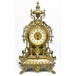 A late 19th century French brass mantel timepiece, with Roman numeral chapter ring and movement