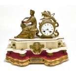 A French 19th century alabaster mantel clock with gilt spelter applied surmount representing a