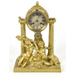 A Continental brass and gilt composition and figural mantel clock, the engraved dial with Roman