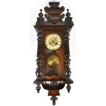 A circa 1900 walnut and beech Vienna style spring driven wall clock, height approx 97cm.Additional