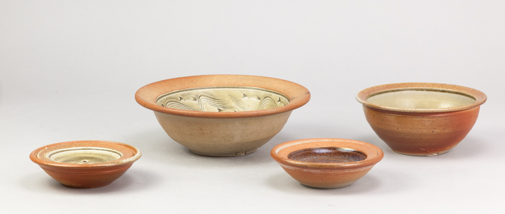 ALASTAIR HARDIE (born 1941); a wood fired stoneware bowl, green ash glaze to the well with incised