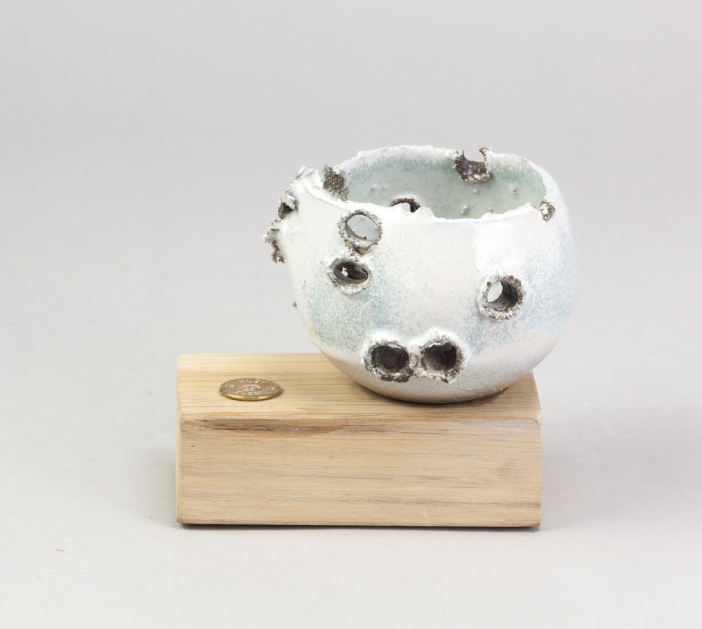 ALLISON WEIGHTMAN (born 1963); a stoneware 'shot' bowl on a wooden stand, white and pale turquoise